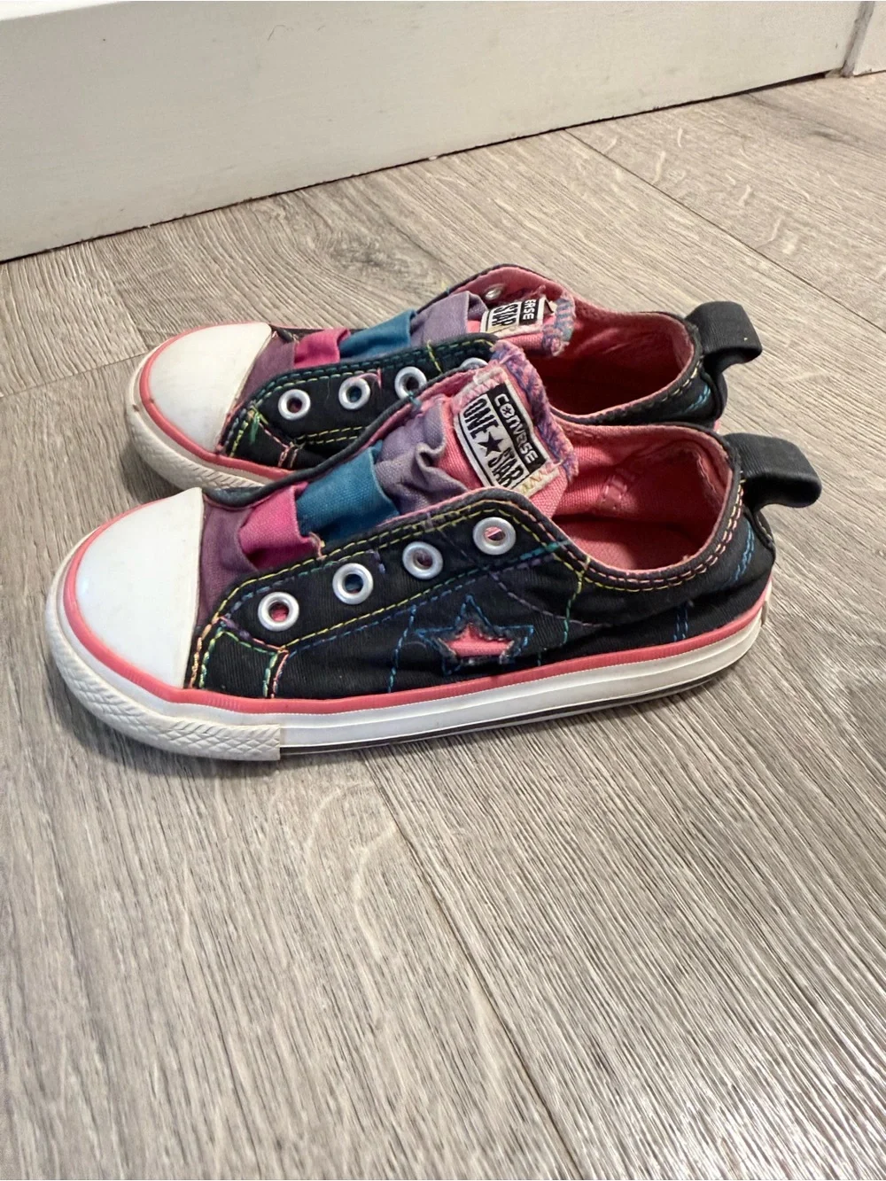 Sold Converse Kids One Star Slip-On Sneakers in Black with Pink and Blue Accents